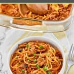 Taco spaghetti casserole serving in a bowl and a fork next to it.