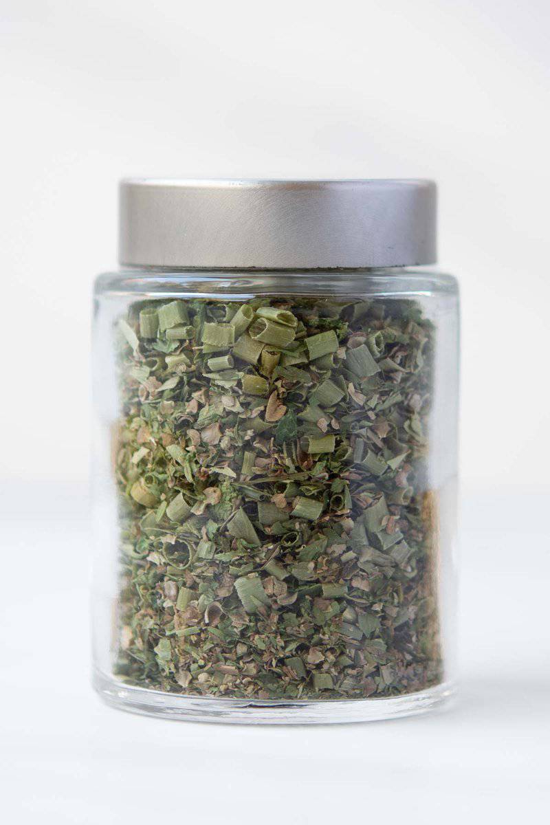 Homemade fines herbes in a spice jar.