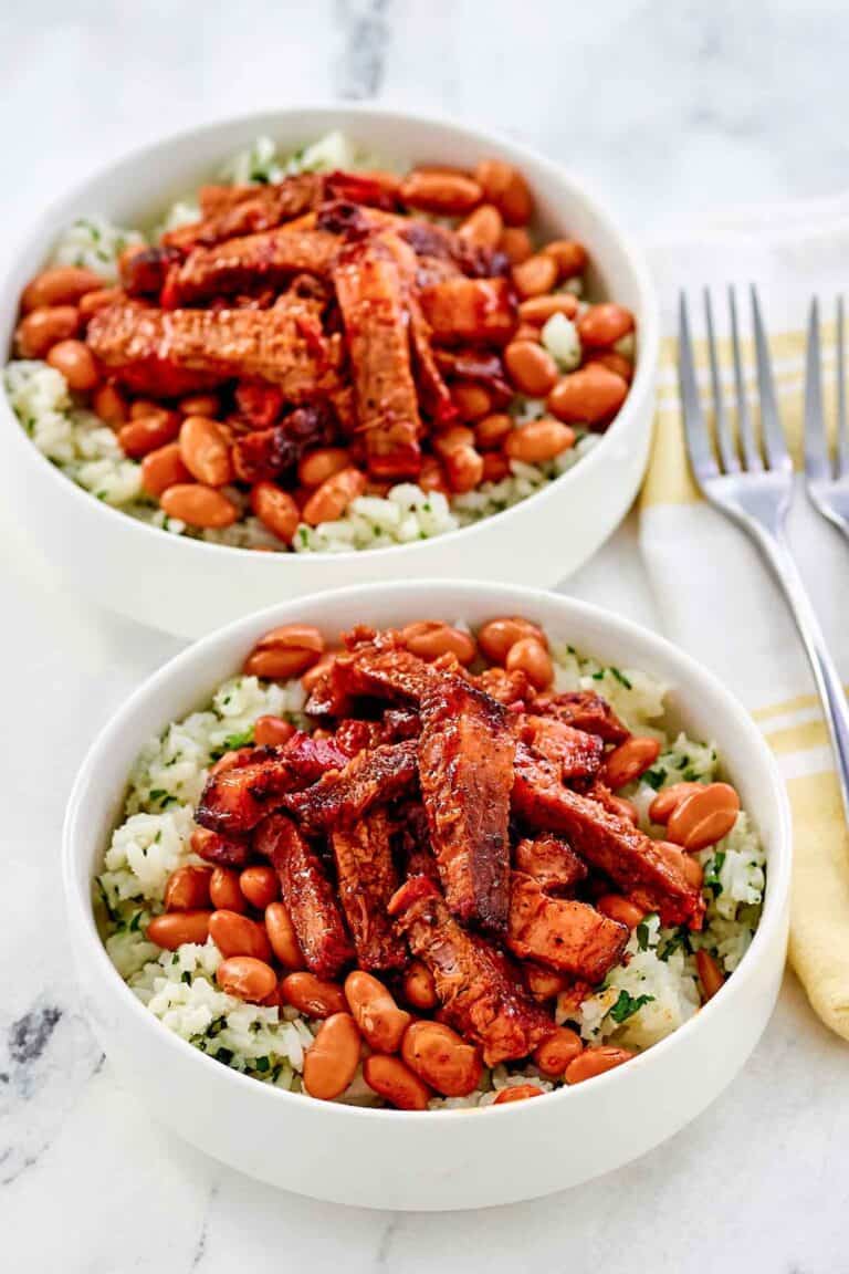 Copycat Chipotle smoked brisket over rice in two bowl.