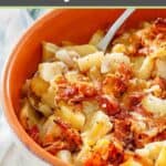 Crockpot cheesy potatoes with bacon in a bowl.