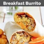 Copycat Sonic ultimate breakfast burrito, tater tots, and orange slices on a plate.