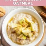 A bowl of oatmeal topped with chopped apples and ground cinnamon.