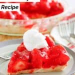 A slice of homemade big boy strawberry pie on a small plate and the pie behind it.