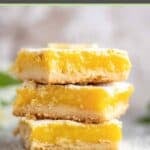 Three homemade classic lemon bars in a stack.