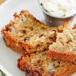 Three slices of rhubarb bread on a plate.