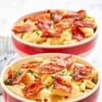 Two bowls of Applebee's 4 cheese mac and cheese with bacon on top.