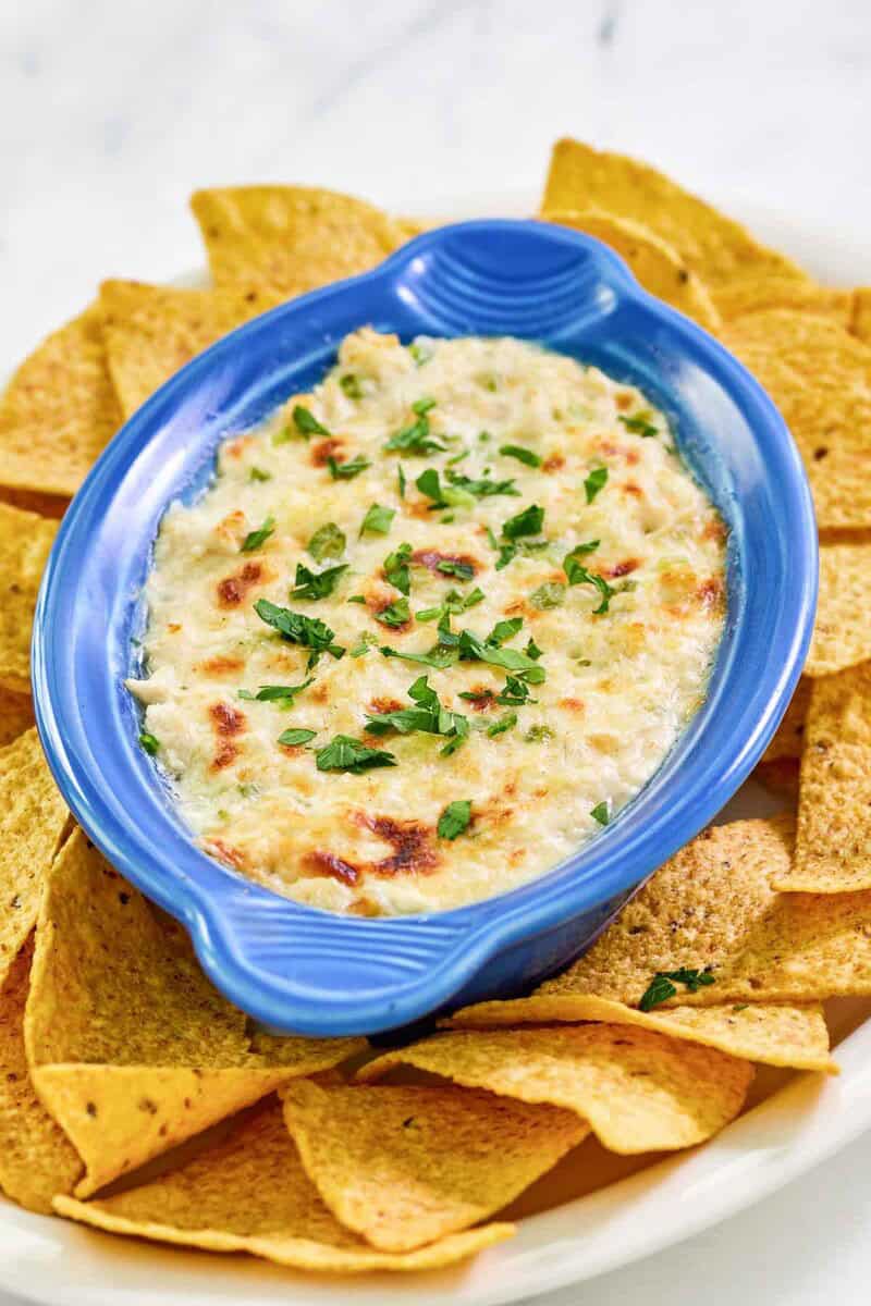Copycat Joe's crab shack crab dip and tortilla chips on a platter.
