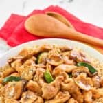 A bowl of homemade Panda Express mushroom chicken served over rice.