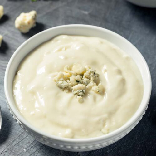 Copycat Simon and Seafort's blue cheese dressing and blue cheese crumbles.