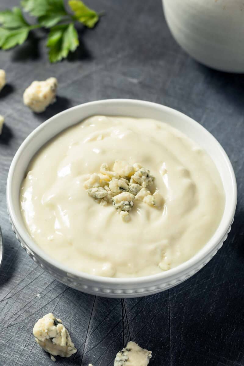 Copycat Simon and Seafort's blue cheese dressing and blue cheese crumbles.