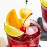 Copycat Applebee's red apple sangria in a lowball glass.