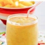 A homemade dole whip with rum float with a straw in it.