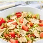 Homemade green jacket salad with dressing in a bowl.