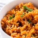 A bowl of homemade Guadalajara Spanish rice garnished with cilantro.