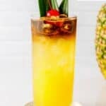 Homemade PF Chang's mai tai garnished with a cherry.