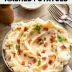 Homemade Ponderosa Steakhouse loaded mashed potatoes, fork, spoon, and napkin.