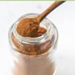 Homemade pumpkin pie spice mix in a small glass jar.