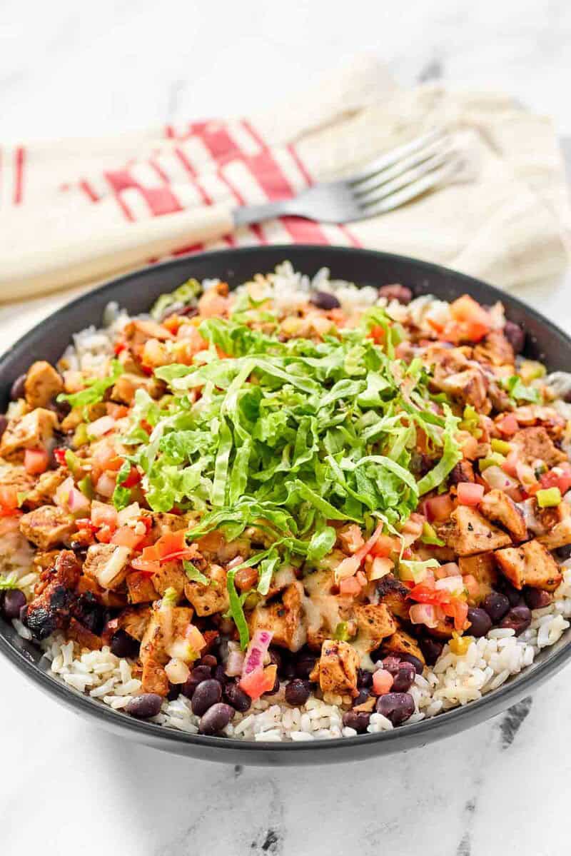 Copycat chipotle honey chicken, beans, and pico de gallo over rice.