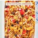 Frito taco salad with catalina dressing on a platter.
