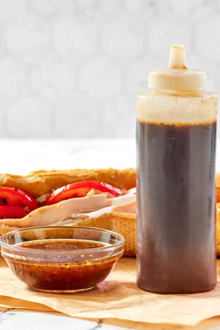 Copycat Subway sweet onion teriyaki sauce in a small bowl and squeeze bottle.