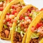 Homemade fresco style taco bell crunchy tacos on a platter.