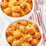 Two copycat KFC famous bowls and two forks on napkins.