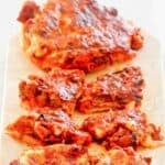 Old-fashioned school cafeteria pizza burgers on a platter.