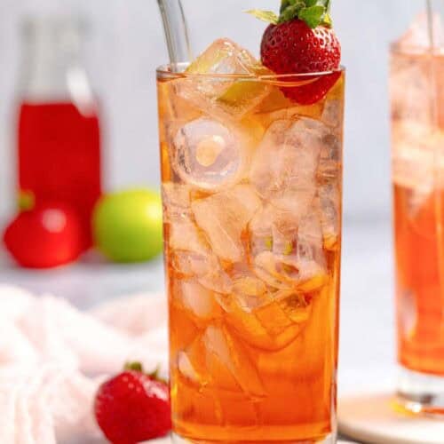 Copycat Sonic strawberry limeade in a tall glass on a coaster.