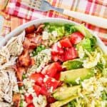 Copycat Brown Derby cobb salad and a fork on a cloth napkin.