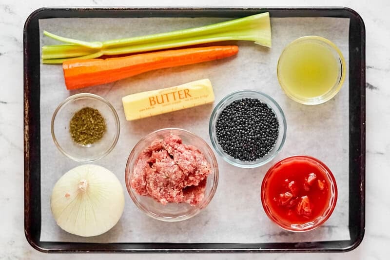 Copycat Carrabba's sausage and lentil soup ingredients on a tray.