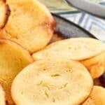 Copycat Cracker Barrel cornbread muffins piled on a plate.