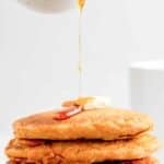 A stack of copycat IHOP pumpkin pancakes served with butter and syrup.