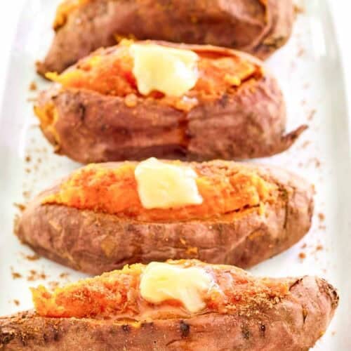 Copycat Outback Steakhouse baked sweet potatoes with honey butter and brown sugar.