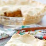 A slice of sugar free apple pie and the pie behind it.