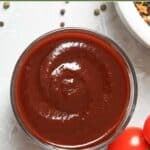 Homemade Swiss Chalet BBQ sauce in a small glass bowl.
