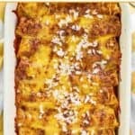Homemade El Chico cheese enchiladas topped with a sprinkle of chopped onions.