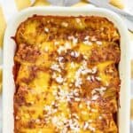 Copycat El Chico cheese enchiladas in a rectangular baking dish.