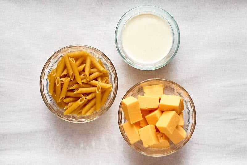 Copycat Outback Steakhouse mac and cheese ingredients in bowls.