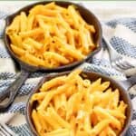 Homemade Outback Steakhouse mac and cheese served in cast iron skillets.