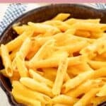 Homemade Outback Steakhouse mac and cheese in a small cast iron skillet.