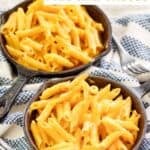 Homemade Outback Steakhouse mac and cheese in small cast iron skillets.