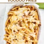 Homemade Wingstop Louisiana voodoo fries in a serving basket on a marble surface.