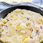 Homemade Cheesecake Factory mashed potatoes and a pat of butter melting on top.