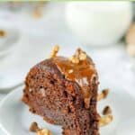 A slice of triple chocolate bundt cake on a plate.