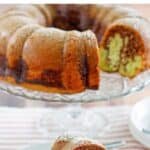 Homemade chocolate pistachio bundt cake on a cake stand and a slice on a plate.