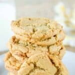 A stack of homemade gingersnap cookies on a plate.