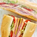 Homemade Kmart deli sub sandwiches on parchment paper.