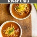 Lady Bird Johnson's Pedernales River chili topped with shredded cheese and sliced green onions.