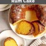 Homemade Ms. Bessie's New Orleans rum cake with a few slices cut out and one on a plate.
