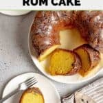 Homemade Ms. Bessie's New Orleans rum cake slice on a plate and the cake partially sliced.